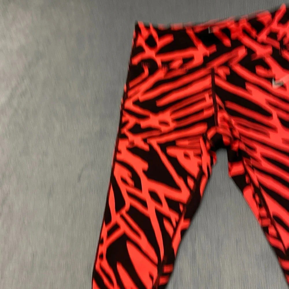 Nike Dri Fit Power Epic Lux Capri Leggings Womens XS Black Orange Abstract Print